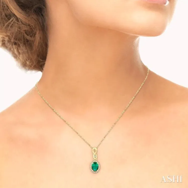 6x4 MM Oval Cut Emerald and 1/10 Ctw Round Cut Diamond Pendant in 10K Yellow Gold with Chain