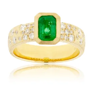 Bezel Set Emerald-Cut Emerald in Yellow Gold with Flush Set Diamond Band